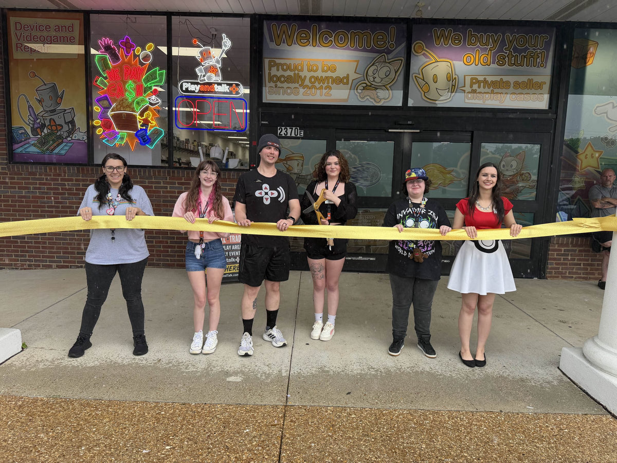 The Play and Talk team outside the store at a ribbon cutting