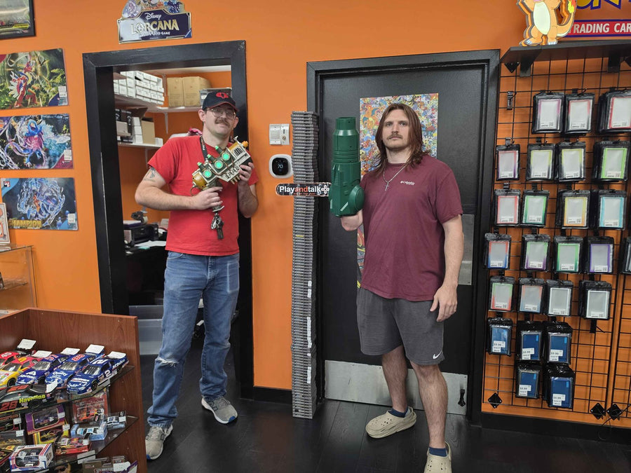 Play and Talk team members by the trading card wall