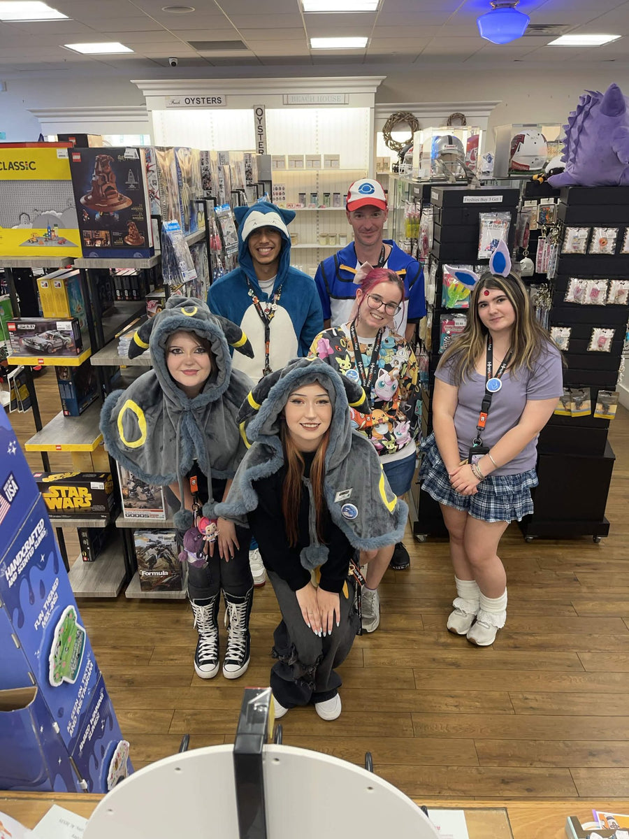 Play and Talk team members in Pokemon costumes inside the store
